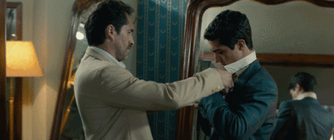 the necktie Chavez ties Gomez necktie, getting him ready to be undercover bait